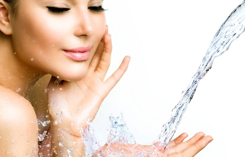 Acne Treatment Tips woman splashing face