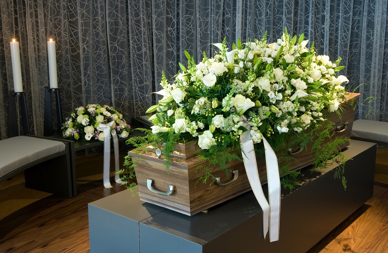 Funeral Flowers on top of casket